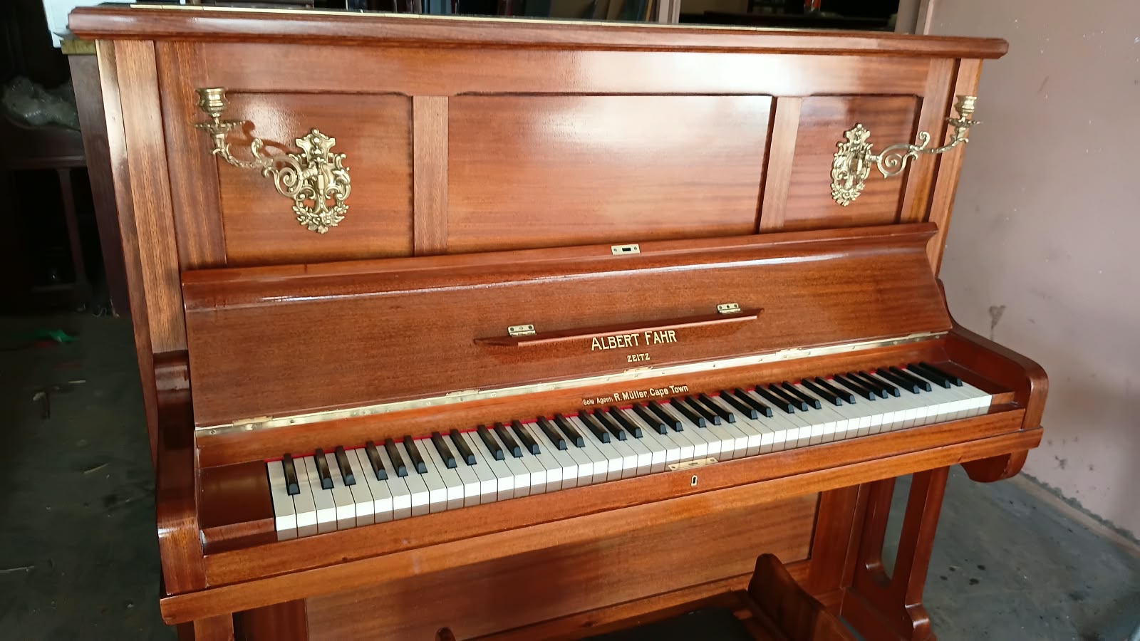 A hand-polished upright piano prepared in the Klavier Sentrum workshop
